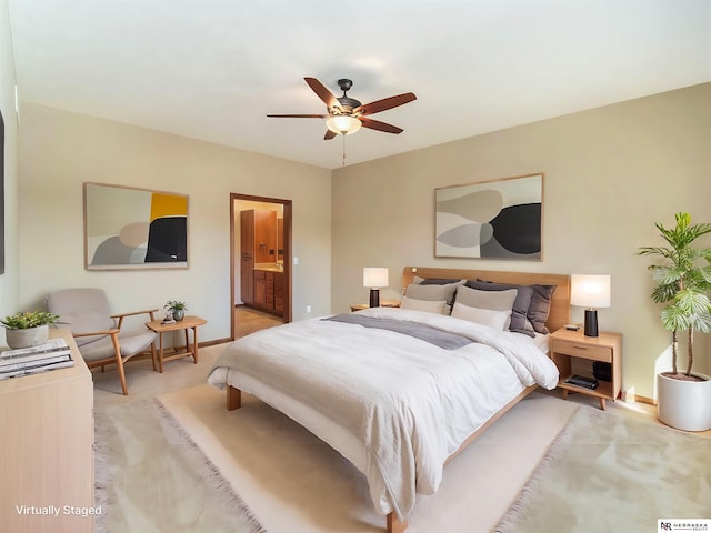 bedroom featuring baseboards, ceiling fan, connected bathroom, and light colored carpet