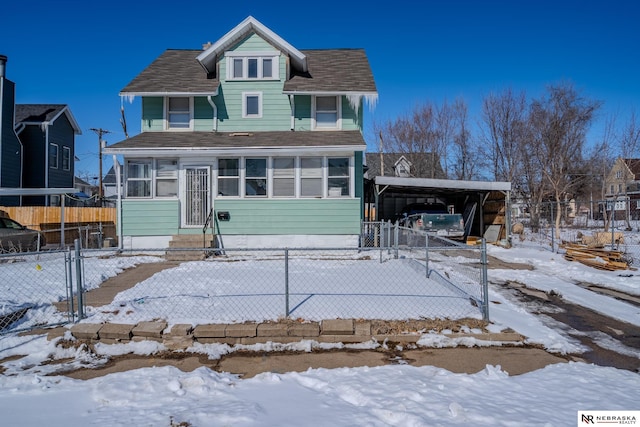 view of front of property with a sunroom, fence, and driveway