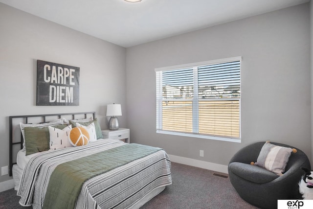 bedroom with carpet, visible vents, and baseboards