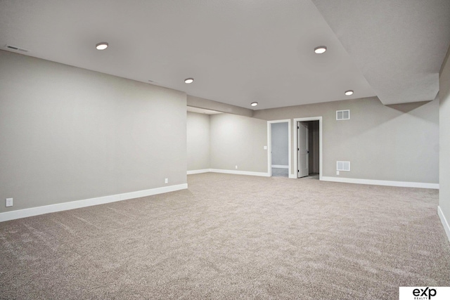 finished basement with recessed lighting, carpet flooring, visible vents, and baseboards