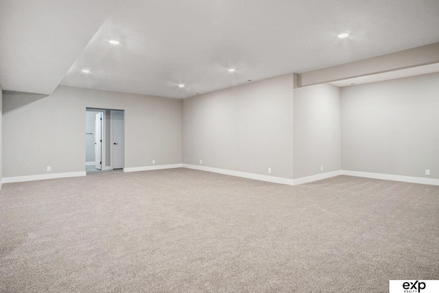 finished basement featuring baseboards, carpet flooring, and recessed lighting