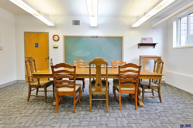 dining area with carpet flooring and visible vents