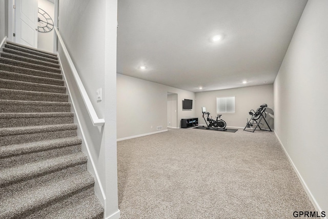 workout room featuring carpet floors, baseboards, and recessed lighting