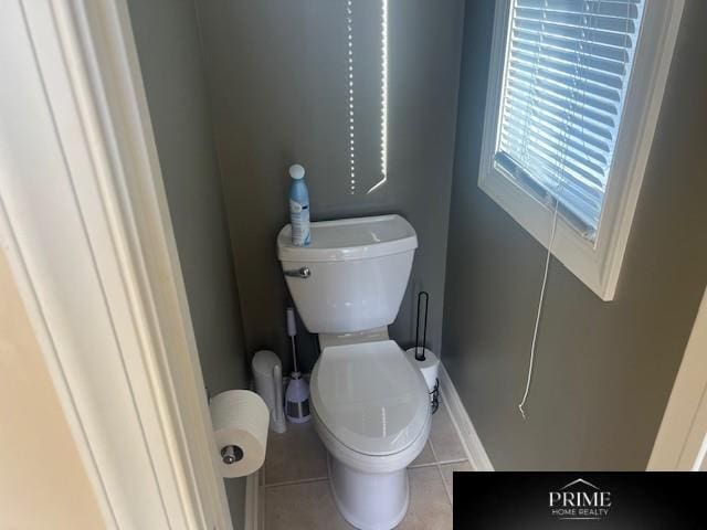 bathroom featuring toilet and tile patterned floors