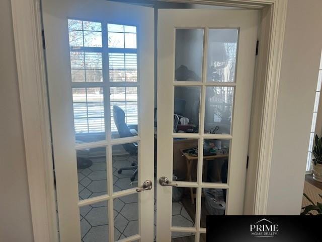 doorway to outside featuring a healthy amount of sunlight and french doors