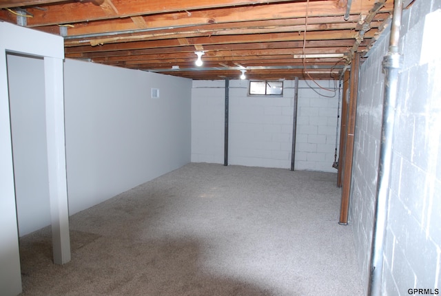 unfinished basement featuring carpet