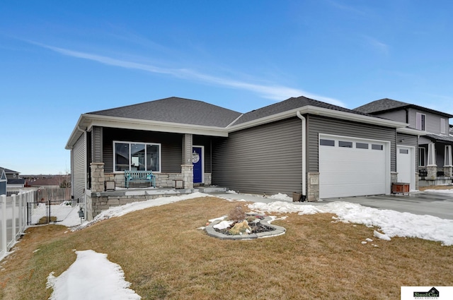 view of front facade featuring a porch, stone siding, fence, and an attached garage