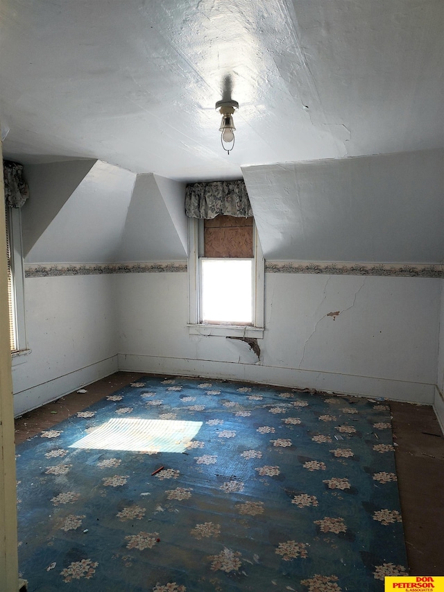 additional living space with lofted ceiling