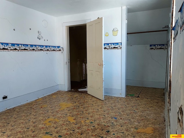 unfurnished bedroom featuring a closet