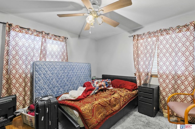 carpeted bedroom with a ceiling fan