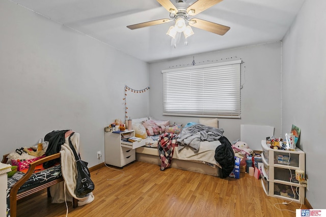 bedroom featuring light wood-type flooring and ceiling fan