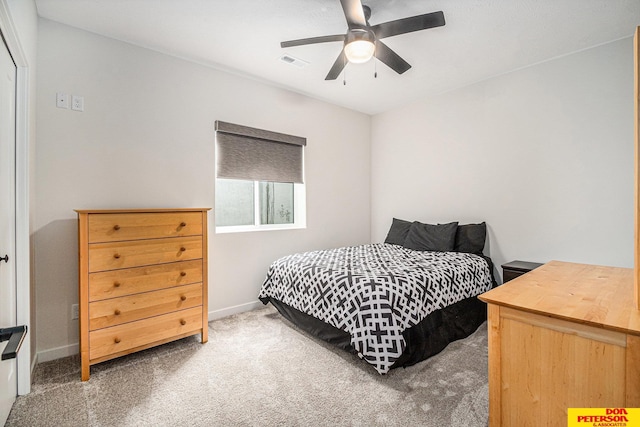 bedroom featuring ceiling fan, carpet flooring, visible vents, and baseboards