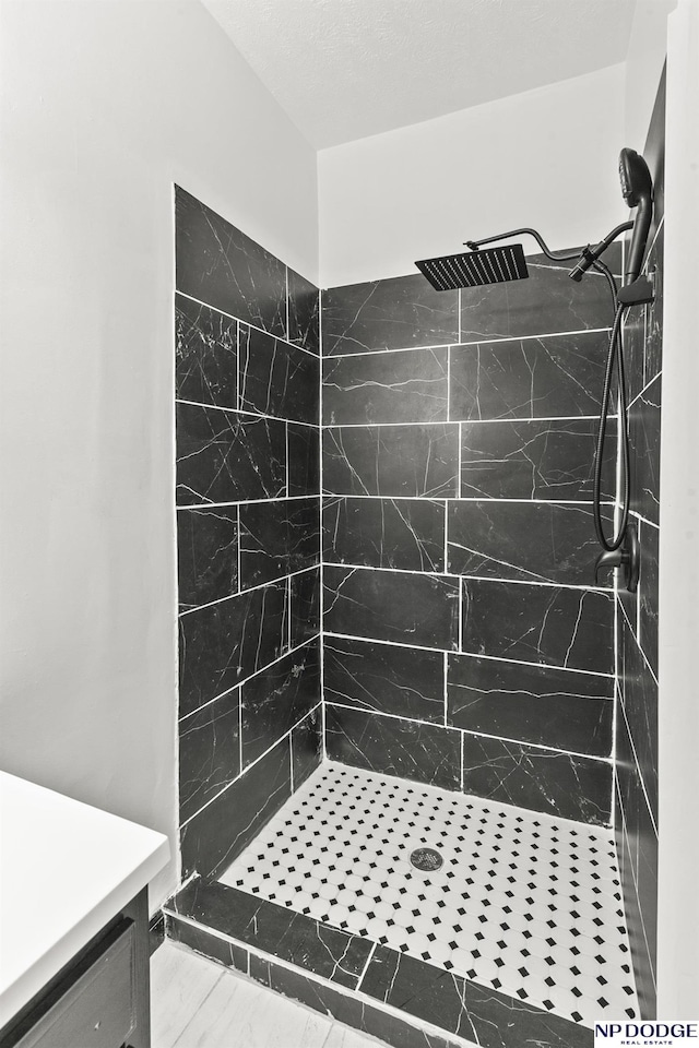 bathroom with a shower stall