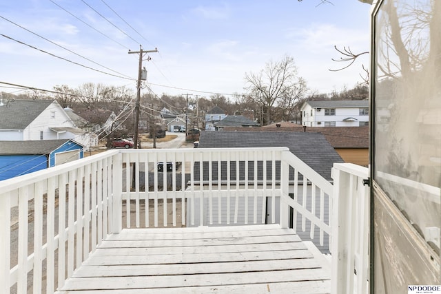 wooden deck featuring a residential view