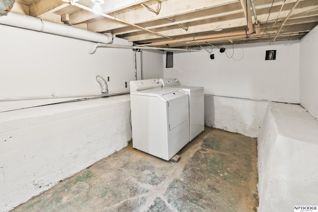 clothes washing area with laundry area and washer and dryer