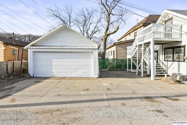 exterior space with central AC and fence