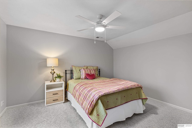 bedroom with baseboards, visible vents, a ceiling fan, light colored carpet, and lofted ceiling