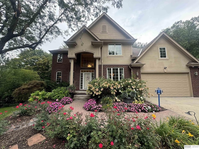 view of front of home featuring concrete driveway and brick siding