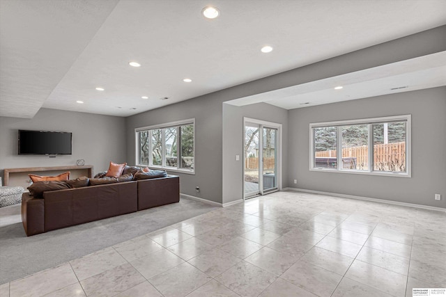 living room with light tile patterned floors, baseboards, and recessed lighting