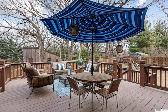 wooden deck with fence and outdoor dining area