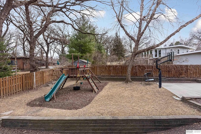 view of playground featuring a fenced backyard