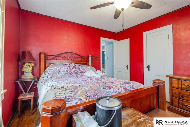 bedroom featuring ceiling fan and wood finished floors