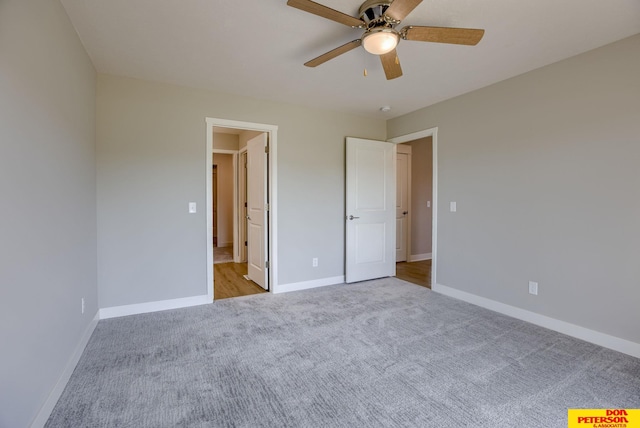 3563 Little Bluestem Rd, Fremont, NE 68025 - unfurnished bedroom with light colored carpet and a ceiling fan