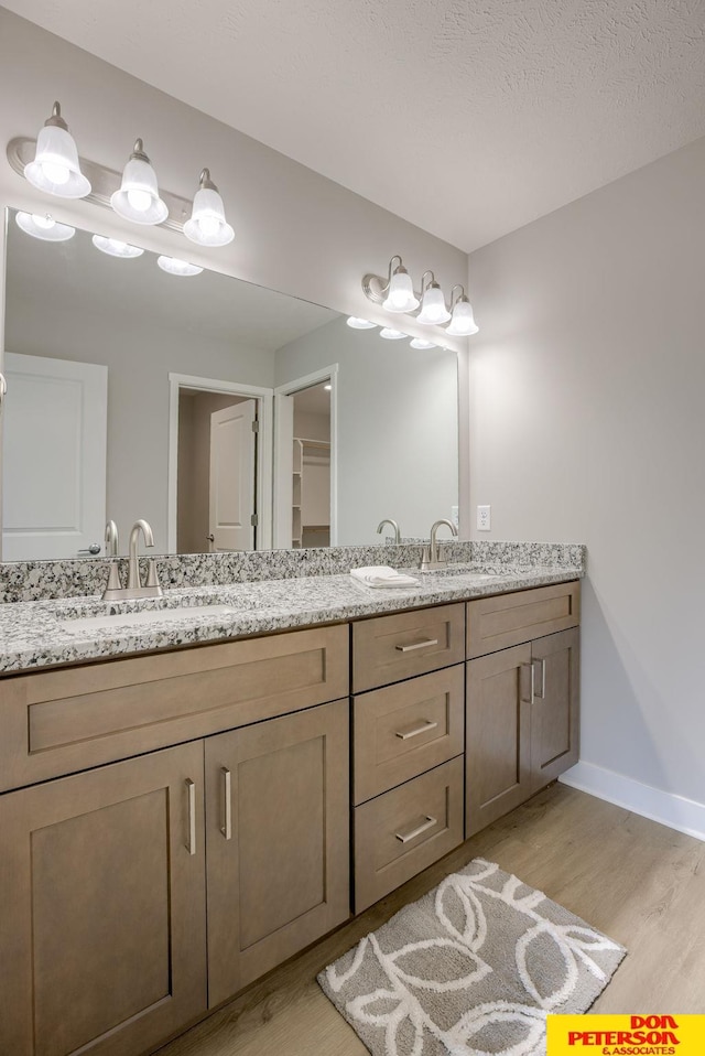 3563 Little Bluestem Rd, Fremont, NE 68025 - bathroom featuring wood finished floors and double vanity