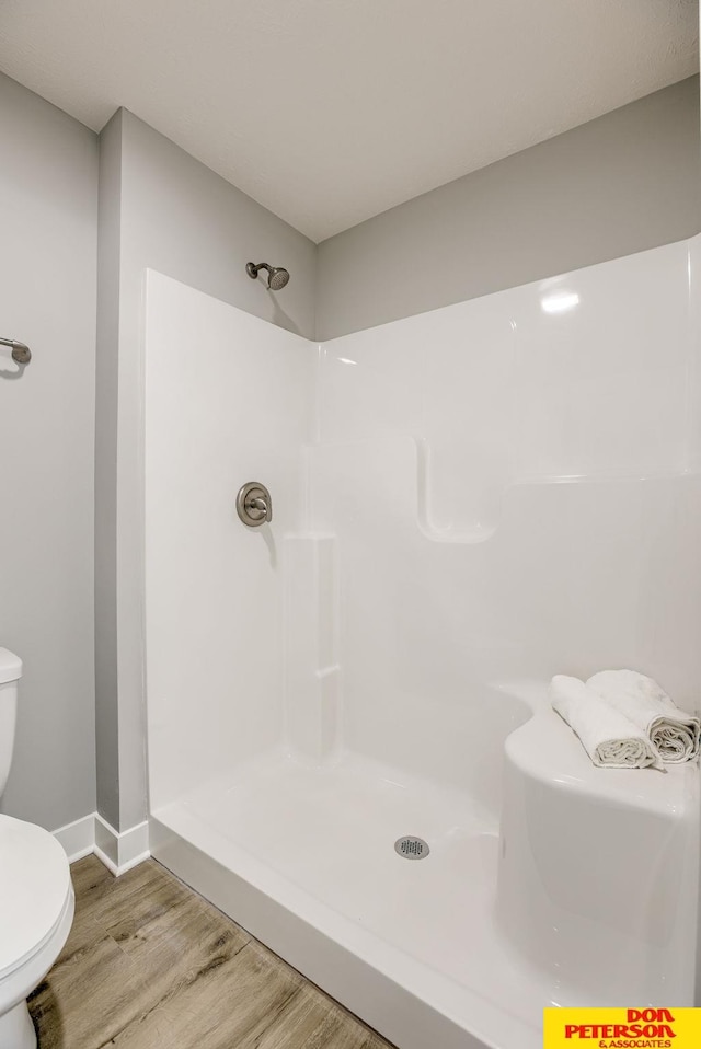 3563 Little Bluestem Rd, Fremont, NE 68025 - full bath with wood finished floors and a shower