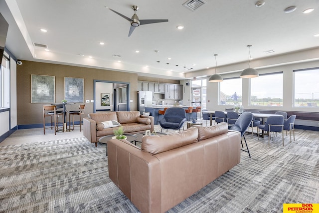 3563 Little Bluestem Rd, Fremont, NE 68025 - living room with light colored carpet, a ceiling fan, and recessed lighting