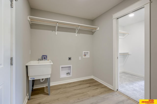 3575 Little Bluestem Rd, Fremont, NE 68025 - washroom with electric dryer hookup, washer hookup, and light wood finished floors
