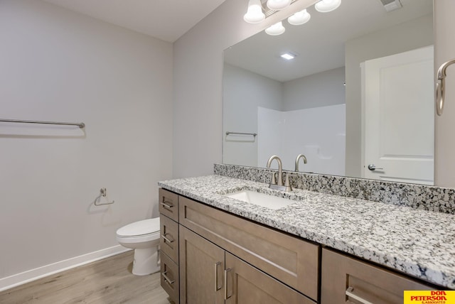 3575 Little Bluestem Rd, Fremont, NE 68025 - bathroom with wood finished floors, vanity, and a shower