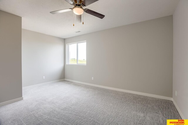 3575 Little Bluestem Rd, Fremont, NE 68025 - unfurnished room featuring light colored carpet and ceiling fan