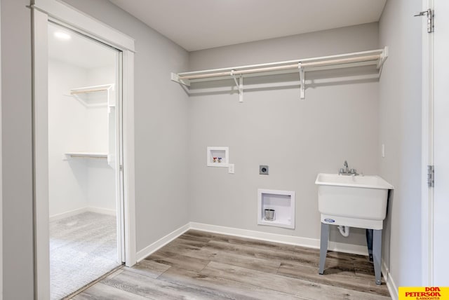 3587 Little Bluestem Rd, Fremont, NE 68025 - washroom with light wood-style flooring, electric dryer hookup, and hookup for a washing machine