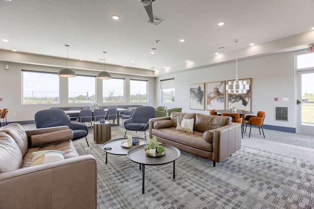 3587 Little Bluestem Rd, Fremont, NE 68025 - living area with recessed lighting, light colored carpet, and plenty of natural light