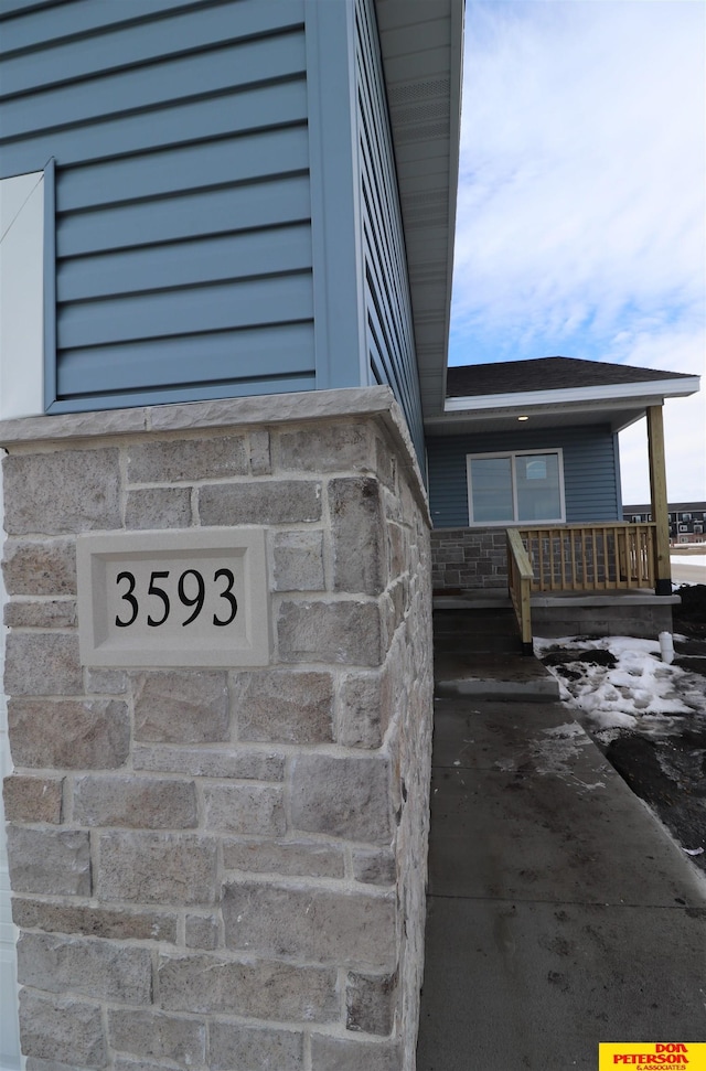 exterior details featuring stone siding