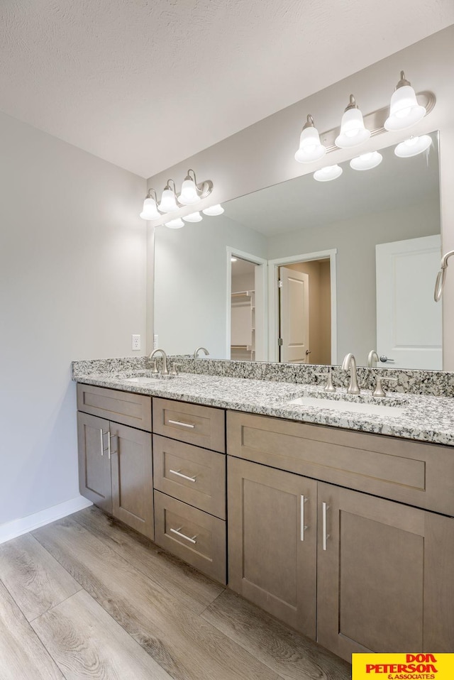 3593 Little Bluestem Rd, Fremont, NE 68025 - full bath featuring wood finished floors and double vanity