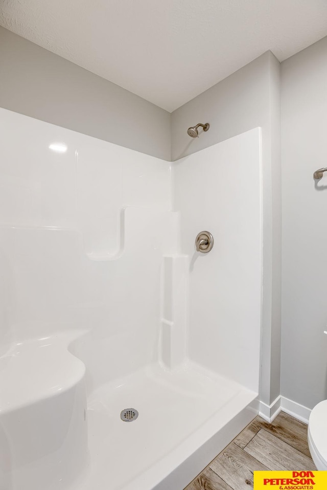 3593 Little Bluestem Rd, Fremont, NE 68025 - bathroom with wood finished floors and a shower
