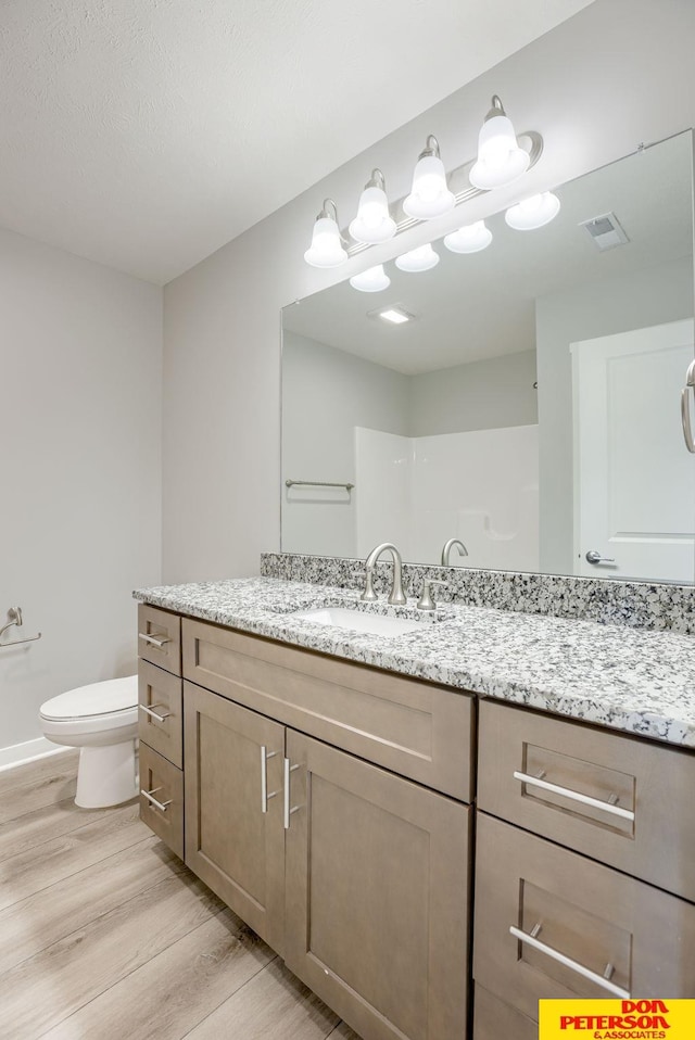 3593 Little Bluestem Rd, Fremont, NE 68025 - bathroom with wood finished floors and vanity