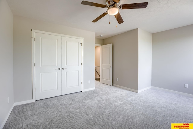 3593 Little Bluestem Rd, Fremont, NE 68025 - unfurnished bedroom with carpet, a closet, and ceiling fan
