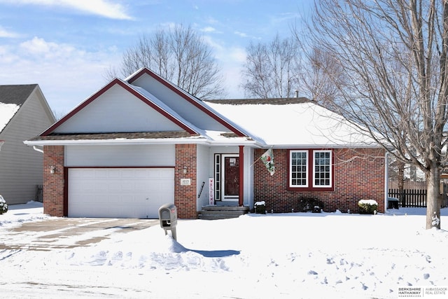 single story home featuring an attached garage, fence, and brick siding