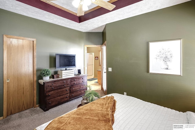 carpeted bedroom featuring a textured ceiling