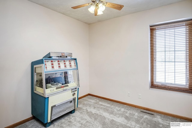 game room with light carpet, visible vents, and baseboards