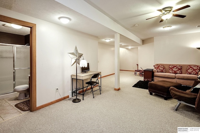 carpeted living room featuring a textured ceiling, a baseboard heating unit, and baseboards