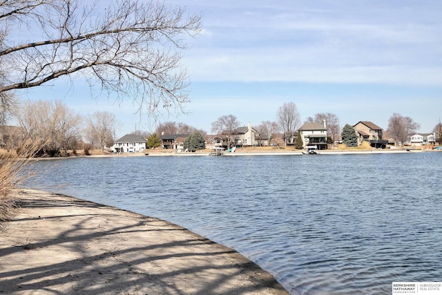 dock area with a water view and a residential view