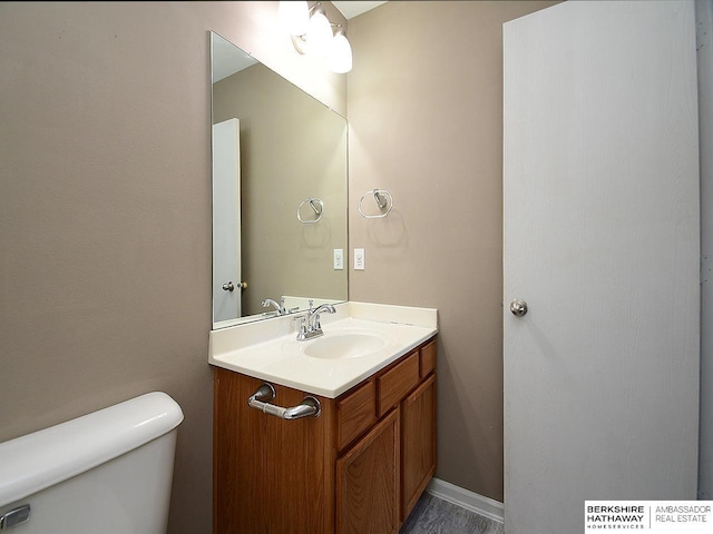 half bath with toilet and vanity