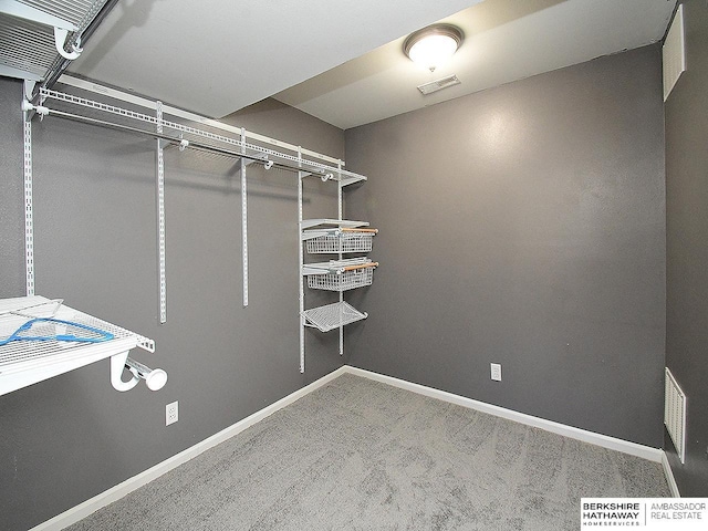 walk in closet with carpet floors and visible vents