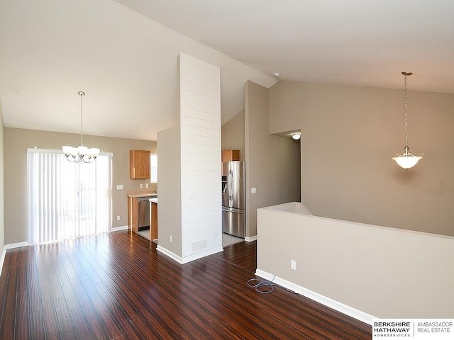 unfurnished living room with dark wood-style floors, baseboards, and an inviting chandelier