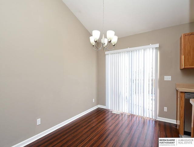 unfurnished dining area with lofted ceiling, baseboards, dark wood finished floors, and a notable chandelier