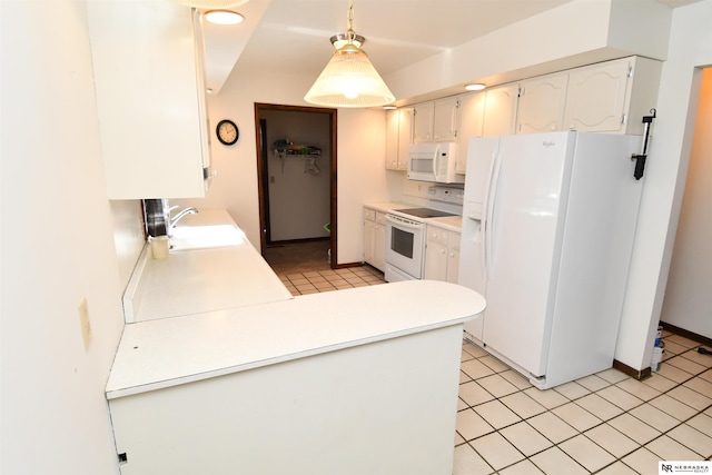 kitchen featuring white appliances, a sink, white cabinetry, light countertops, and decorative light fixtures